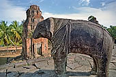 Bakong temple - ruined monolithic elephants mark the corners of the pyramid